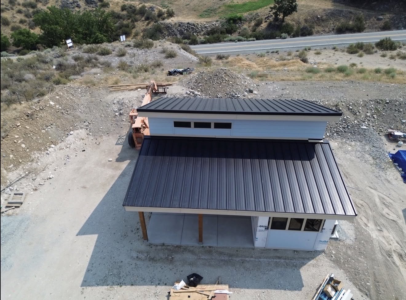 metal roof black standing seam modern home lake 3