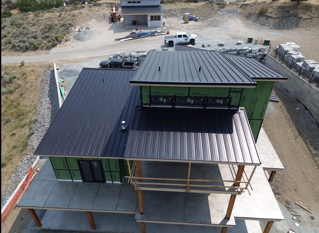 metal roof black standing seam modern home lake 1