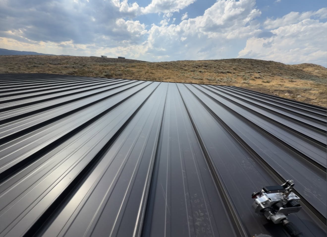 Black standing seam metal roof installation in Wenatchee Washington