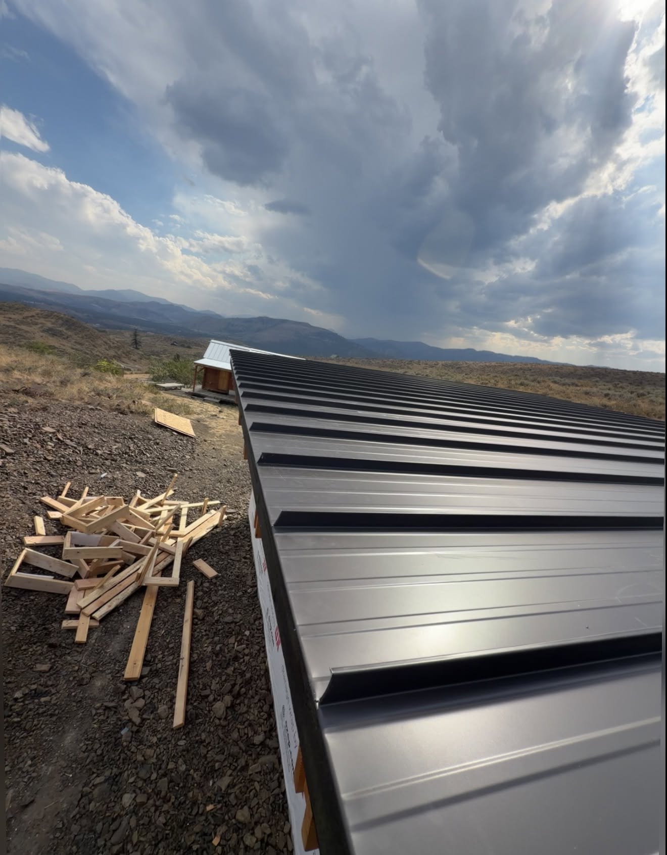 metal roof black ridge detail storm sky