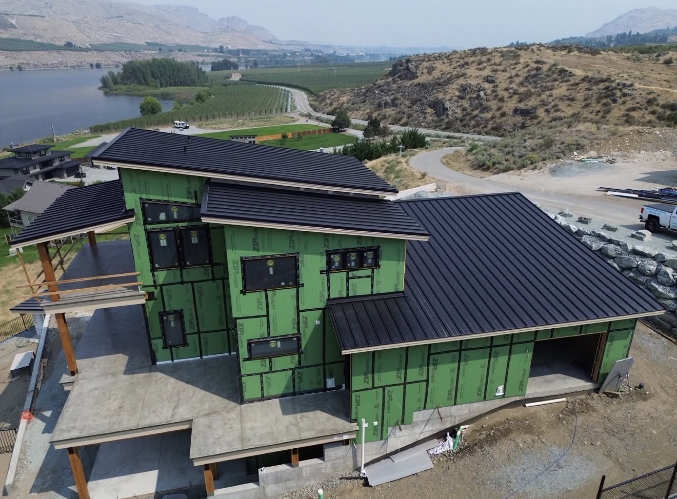 metal roof black standing seam modern home lake 4