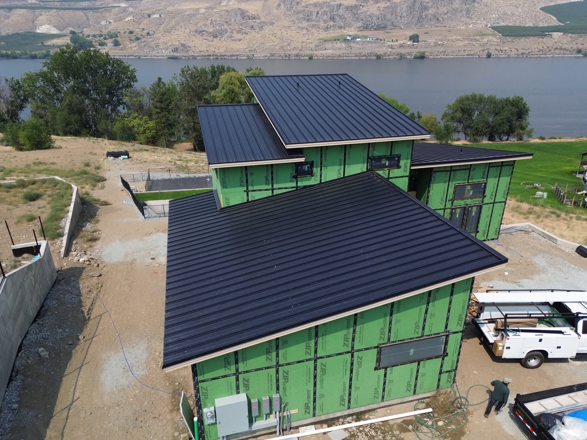metal roof black standing seam modern home lake 5